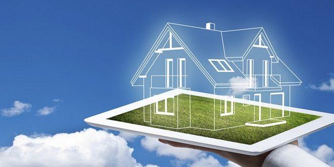 một bàn tay cầm đang đỡ mô hình ngôi nhà, biểu tượng cho ngôi nhà hình thành trong tương lai