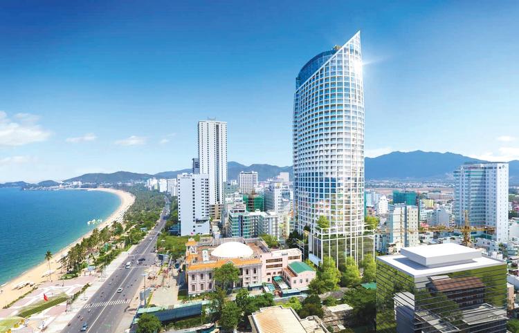 Các công trình nhà ở cao tầng nằm san sát, phía trước là đường lớn và biển