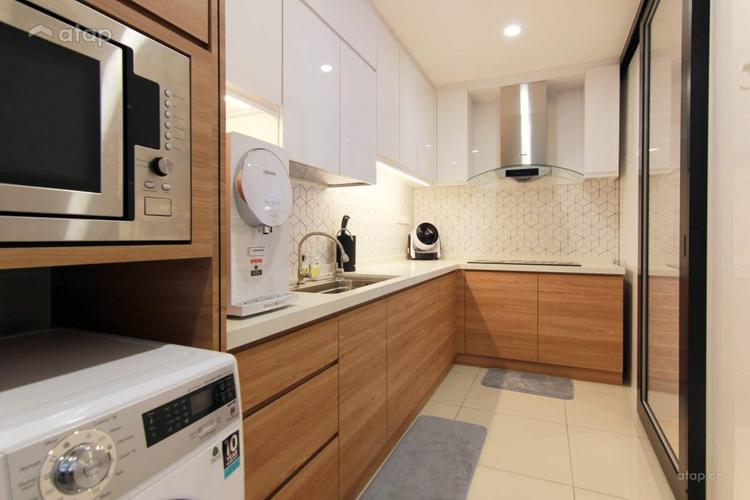Modern kitchen with white and wooden theme, complete with microwave and washing machine