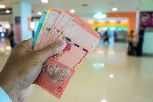 Malaysia money ringgit bill in hand