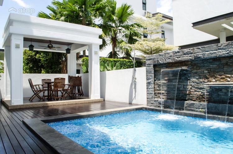 Turning a garden space into an outdoor swimming pool with patio and water features.