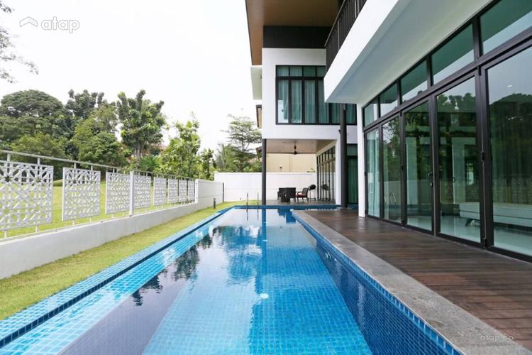 Inground swimming pool that curves around the house for maximum aesthetic pleasure at Haus Saujana Impian.