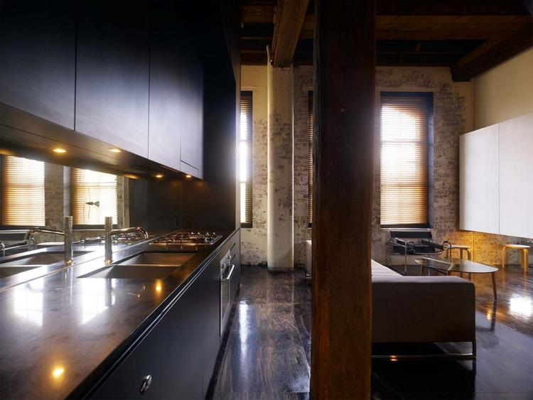 Industrial kitchen design in a warehouse apartment inspired home.