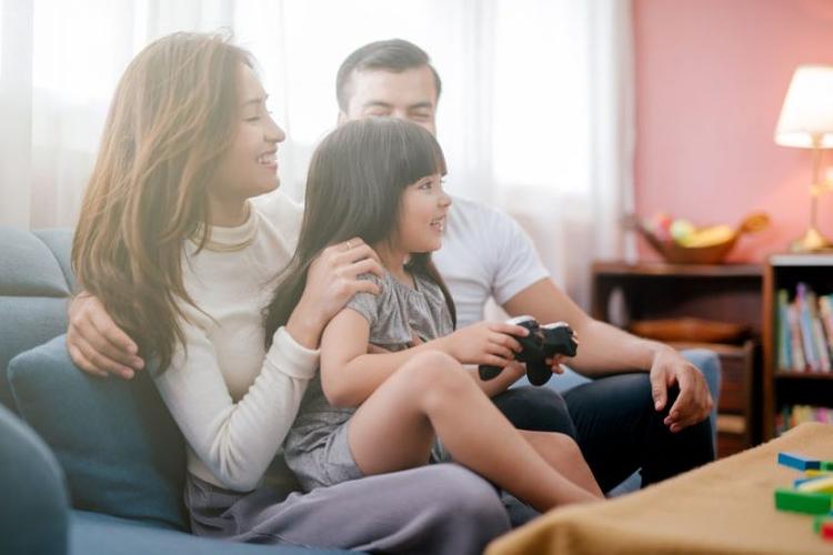 asian-family-playing-video-game-console