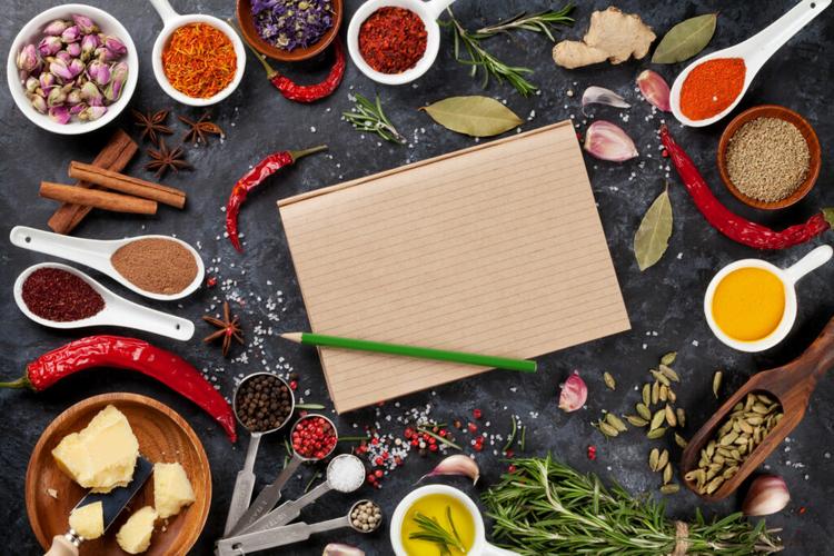ingredients for cooking surrounding notebook
