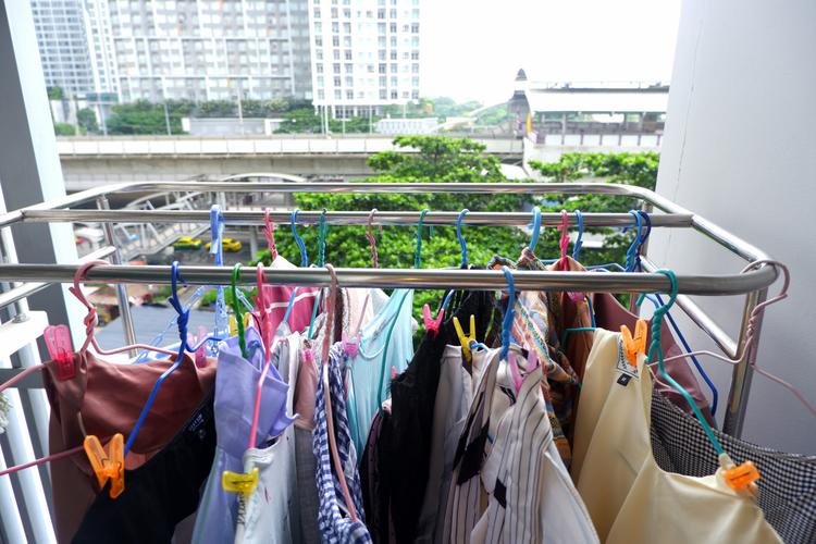 Bra Drying Clothes With Sun At The Balcony Condominium Stock Photo