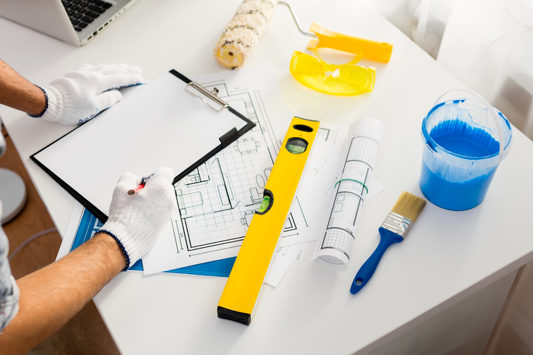 a person reviewing a home renovation plan
