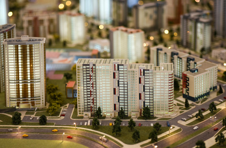 A detailed architectural scale model of a modern residential city