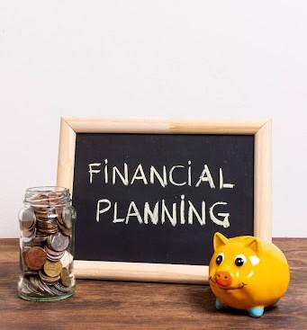 Chalkboard with “Financial Planning” text and a piggy bank