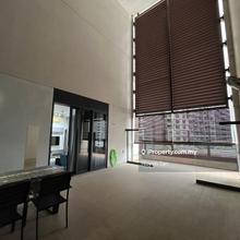 A home with a double volume height covered outdoor space 