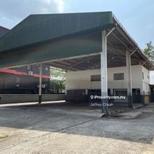 Detached factory facing main road