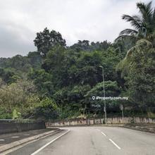 1 acre of roadside land with small stream passing in Penchala