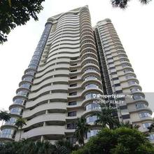 A luxurious condominium is set on a lush greeneries