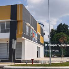 Corner lot facing the main road, located in a busy commercial center.