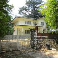 Fixer-upper 2-sty bungalow with sizeable land. Lots of potential.
